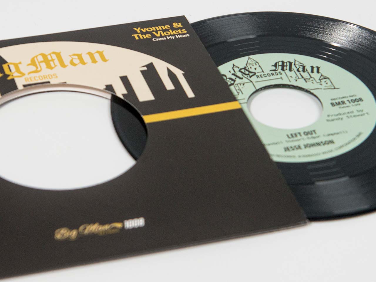 7" dinked vinyl record in sleeve with die cut hole