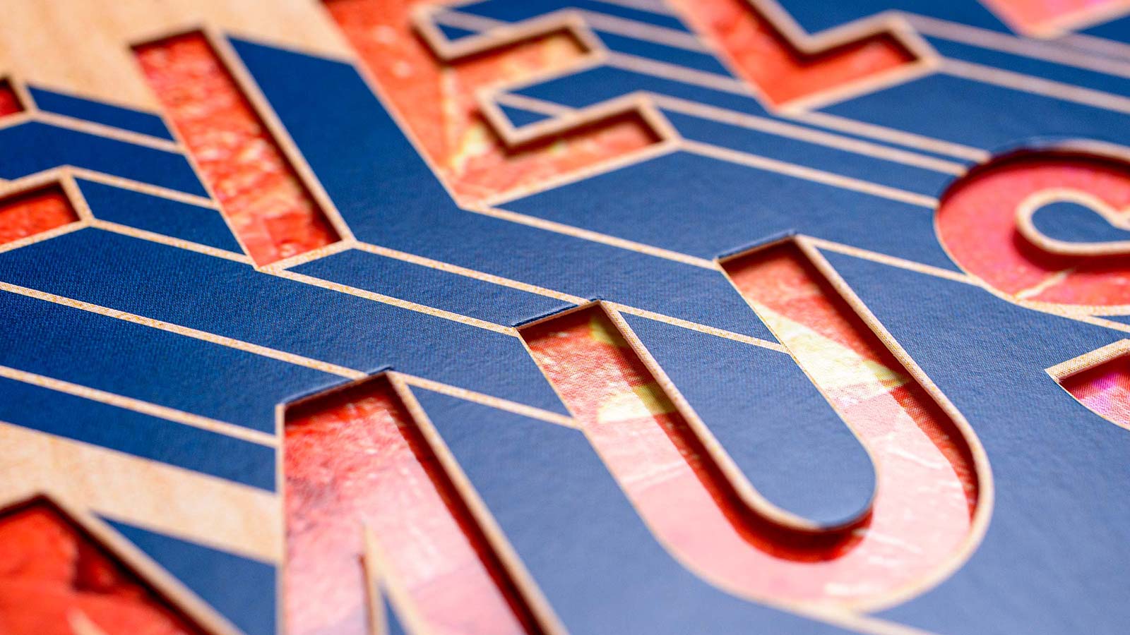 Diecut lettering reveals inner record sleeve.