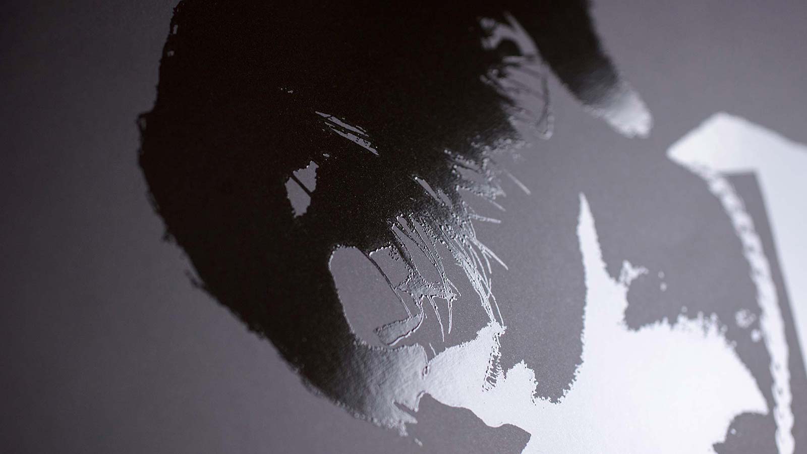 Black on black spot UV varnish.